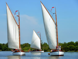 Wherry yachts Olive, right, White Moth, left, and Norada sailing together at Ranworth Broad on Sunday. Photo: Broads Authority