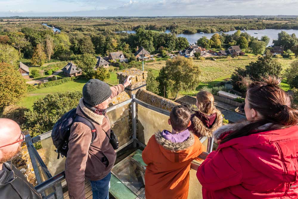 family enjoying the view from the top of the church tower at Ranworth