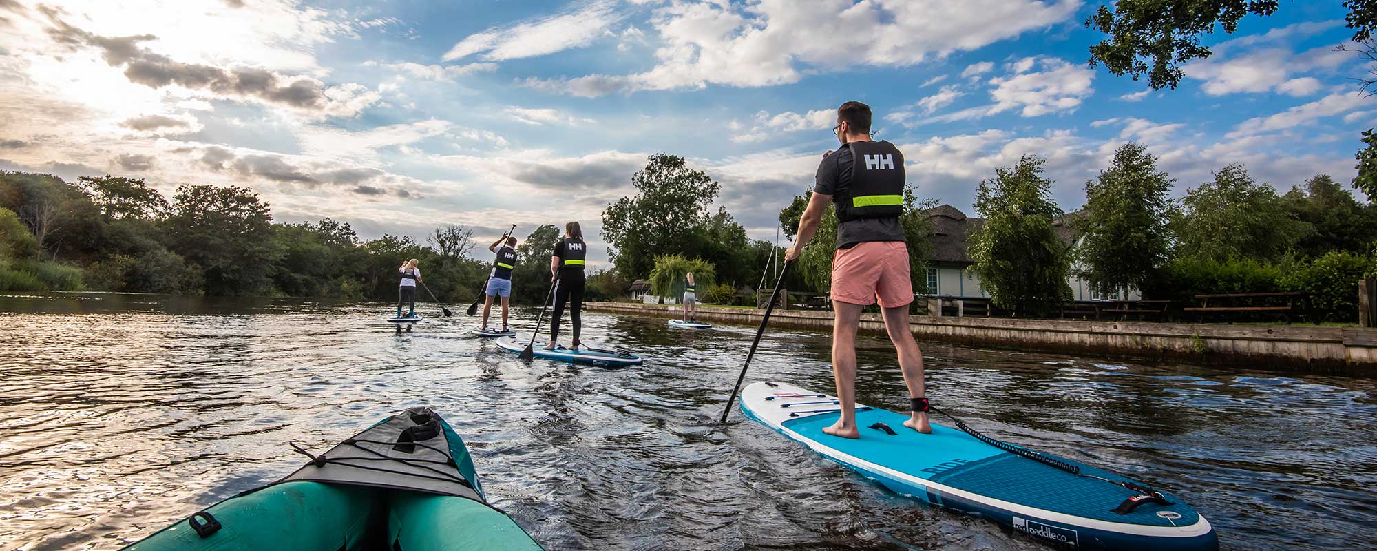Group of people on stand up paddle boards near Horning Norfolk